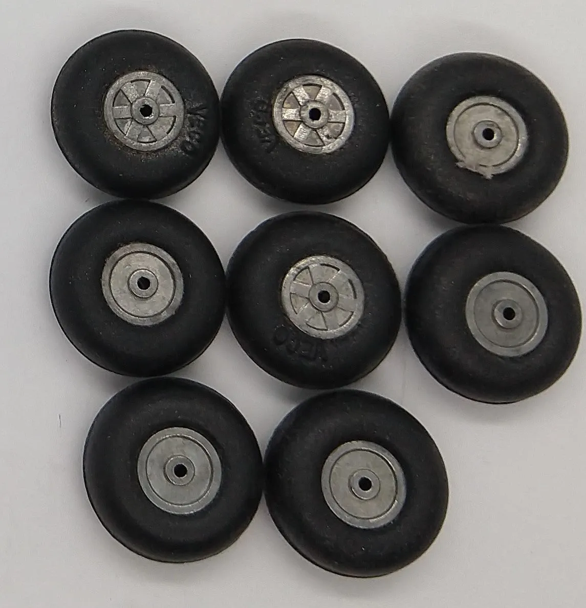 8 Veco Rubber wheels with aluminum hubs 7/8"